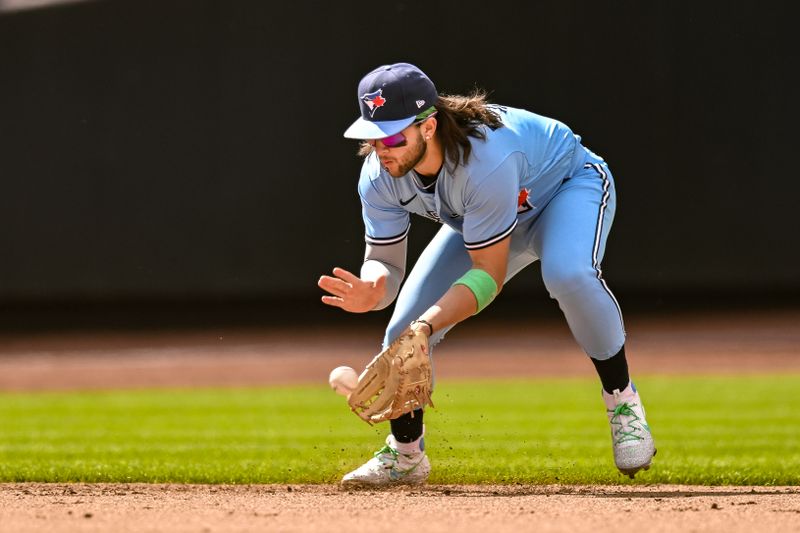 Jun 4, 2023; New York City, New York, USA; Toronto Blue Jays shortstop Bo Bichette (11) fields a ground ball during the seventh inning against the New York Mets at Citi Field. Mandatory Credit: John Jones-USA TODAY Sports