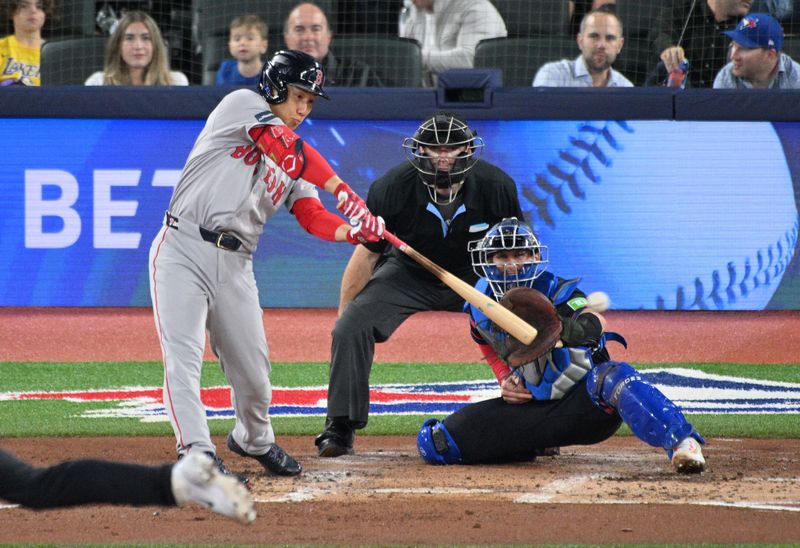 Sep 25, 2024; Toronto, Ontario, CAN;  Boston Red Sox designated hitter Masataka Yoshida (7) hits a double against the Toronto Blue Jays in the fourth inning at Rogers Centre. Mandatory Credit: Dan Hamilton-Imagn Images