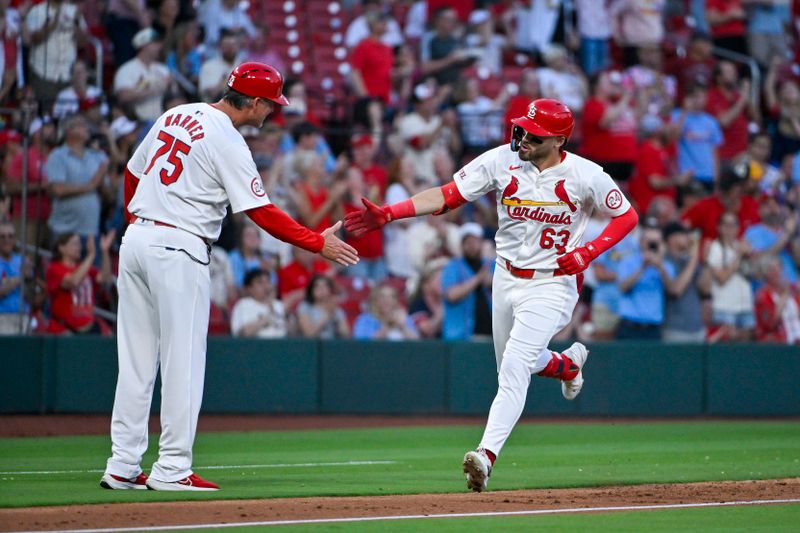 May 20, 2024; St. Louis, Missouri, USA;  St. Louis Cardinals center fielder Michael Siani (63) is congratulated by third base coach Ron 'Pop' Warner (75) after hitting a three run home run against the Baltimore Orioles during the fourth inning at Busch Stadium. Mandatory Credit: Jeff Curry-USA TODAY Sports