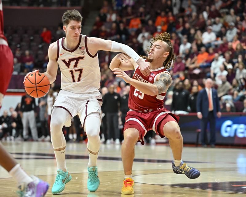 Jan 7, 2026; Blacksburg, Virginia, USA;  Virginia Tech Hokies guard Neoklis Avdalas (17) drives with the basketball defended by Stanford Cardinal guard Jeremy Dent-Smith (25) during the first half at Cassell Coliseum. Mandatory Credit: Brian Bishop-Imagn Images