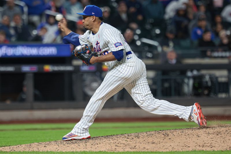 May 12, 2024; New York City, New York, USA; New York Mets relief pitcher Edwin Diaz (39) delivers a pitch during the ninth inning against the Atlanta Braves at Citi Field. Mandatory Credit: Vincent Carchietta-USA TODAY Sports