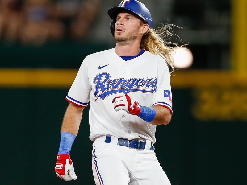 Aug 2, 2023; Arlington, Texas, USA; Texas Rangers left fielder Travis Jankowski (16) hits a two run double during the second inning against the Chicago White Sox at Globe Life Field. Mandatory Credit: Andrew Dieb-USA TODAY Sports