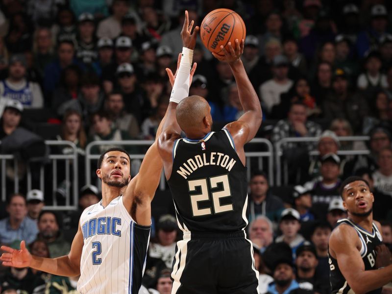 MILWAUKEE, WI - JANUARY 15:  Khris Middleton #22 of the Milwaukee Bucks shoots the ball during the game against the Orlando Magic on January 15, 2025 at Fiserv Forum Center in Milwaukee, Wisconsin. NOTE TO USER: User expressly acknowledges and agrees that, by downloading and or using this Photograph, user is consenting to the terms and conditions of the Getty Images License Agreement. Mandatory Copyright Notice: Copyright 2025 NBAE (Photo by Gary Dineen/NBAE via Getty Images).