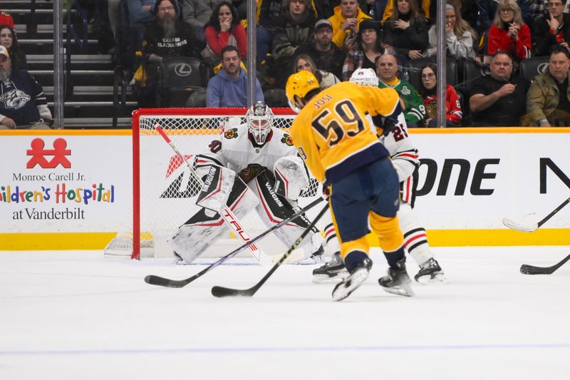 Jan 16, 2025; Nashville, Tennessee, USA;  Nashville Predators defenseman Roman Josi (59) takes a shot on goal against the Chicago Blackhawks during the overtime period at Bridgestone Arena. Mandatory Credit: Steve Roberts-Imagn Images