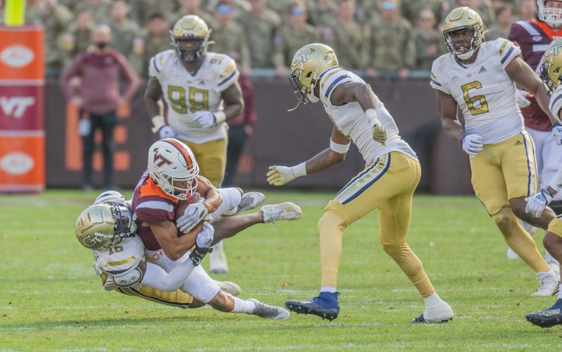 Nov 5, 2022; Blacksburg, Virginia, USA;   Virginia Tech Hokies wide receiver Jadan Blue (2) gets tackled by  tackled by Georgia Tech Yellow Jackets defensive back KJ Wallace (16) in the second half at Lane Stadium. Mandatory Credit: Lee Luther Jr.-USA TODAY Sports