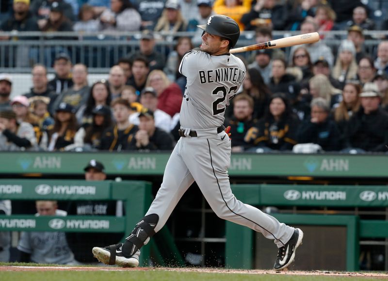 Apr 8, 2023; Pittsburgh, Pennsylvania, USA;  Chicago White Sox left fielder Andrew Benintendi (23) hits a single against the Pittsburgh Pirates during the first inning at PNC Park. Mandatory Credit: Charles LeClaire-USA TODAY Sports