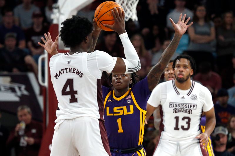 Feb 8, 2023; Starkville, Mississippi, USA; LSU Tigers guard Cam Hayes (1) defends Mississippi State Bulldogs guard/forward Cameron Matthews (4) during the second half at Humphrey Coliseum. Mandatory Credit: Petre Thomas-USA TODAY Sports