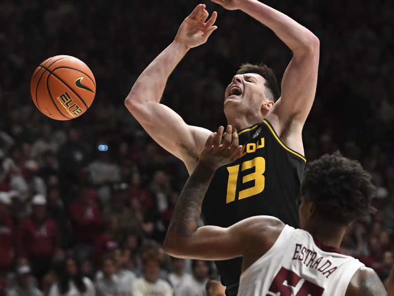 Jan 16, 2024; Tuscaloosa, Alabama, USA; Missouri forward Jesus Carralero Martin (13) reacts after having the ball knocked away by Alabama guard Aaron Estrada in their game at Coleman Coliseum. Mandatory Credit: Gary Cosby Jr.-USA TODAY Sports