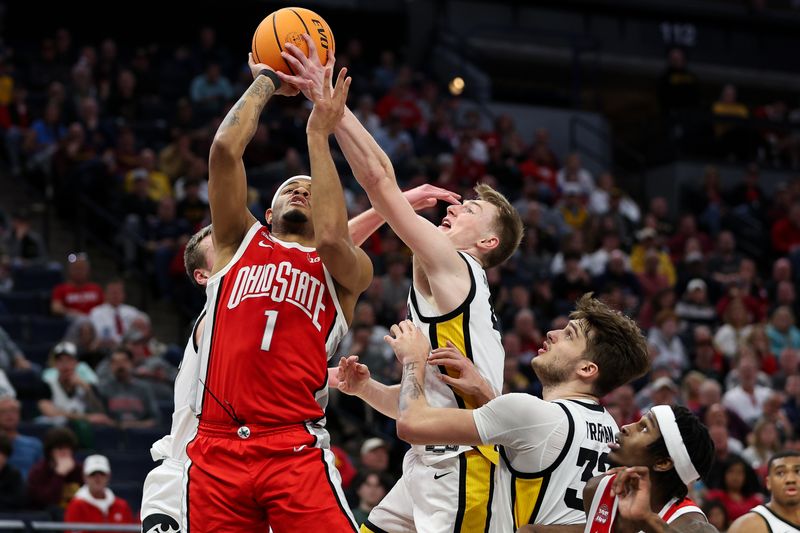 Mar 14, 2024; Minneapolis, MN, USA; Iowa Hawkeyes guard Josh Dix (4) blocks a shot by Ohio State Buckeyes guard Roddy Gayle Jr. (1) during the second half at Target Center. Mandatory Credit: Matt Krohn-USA TODAY Sports