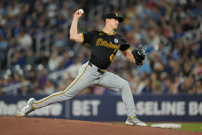 Jun 2, 2024; Toronto, Ontario, CAN; Pittsburgh Pirates starting pitcher Quinn Priester (46) pitches to the Toronto Blue Jays during the first inning at Rogers Centre. Mandatory Credit: John E. Sokolowski-USA TODAY Sports