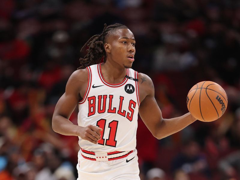 CHICAGO, ILLINOIS - DECEMBER 08: Ayo Dosunmu #11 of the Chicago Bulls dribbles up the court against the Philadelphia 76ers during the second half at the United Center on December 08, 2024 in Chicago, Illinois. NOTE TO USER: User expressly acknowledges and agrees that, by downloading and or using this photograph, User is consenting to the terms and conditions of the Getty Images License Agreement.  (Photo by Michael Reaves/Getty Images)