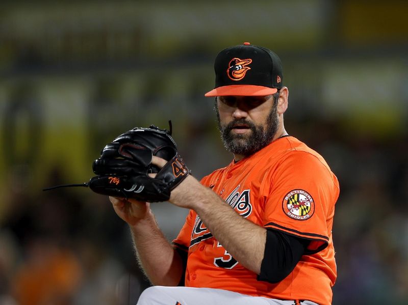 Jun 7, 2025; West Sacramento, California, USA; Baltimore Orioles pitcher Andrew Kittredge (39) throws a pitch against the Athletics during the eighth inning at Sutter Health Park. Mandatory Credit: Dennis Lee-Imagn Images