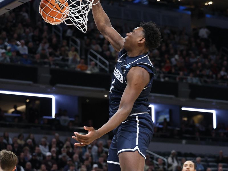 Mar 24, 2024; Indianapolis, IN, USA; Utah State Aggies forward Great Osobor (1) dunks against the Purdue Boilermakers during the first half at Gainbridge FieldHouse. Mandatory Credit: Trevor Ruszkowski-USA TODAY Sports