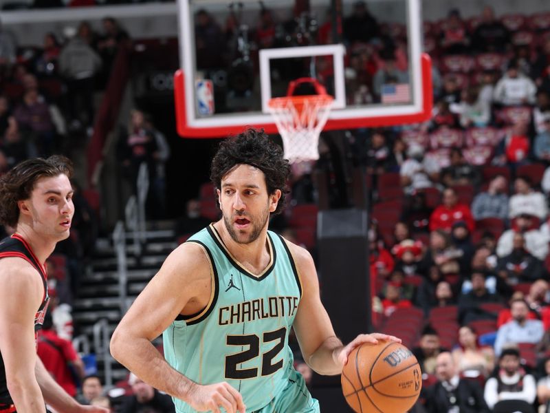 CHICAGO, IL - DECEMBER 13: Vasilije Micic #22 of the Charlotte Hornets  dribbles the ball during the game against the Chicago Bulls on December 13, 2024 at United Center in Chicago, Illinois. NOTE TO USER: User expressly acknowledges and agrees that, by downloading and or using this photograph, User is consenting to the terms and conditions of the Getty Images License Agreement. Mandatory Copyright Notice: Copyright 2024 NBAE (Photo by Jeff Haynes/NBAE via Getty Images)