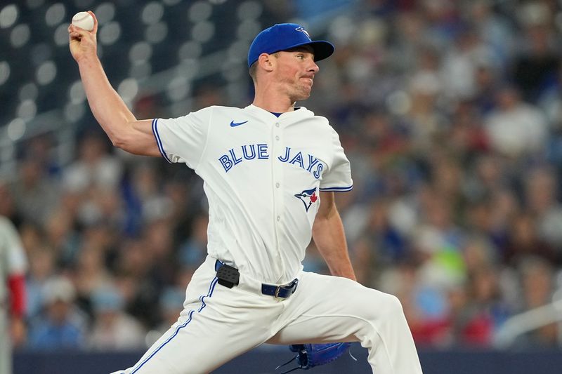 Jun 5, 2025; Toronto, Ontario, CAN; Toronto Blue Jays starting pitcher Chris Bassitt (40) pitches to the Philadelphia Phillies during the first inning at Rogers Centre. Mandatory Credit: John E. Sokolowski-Imagn Images
