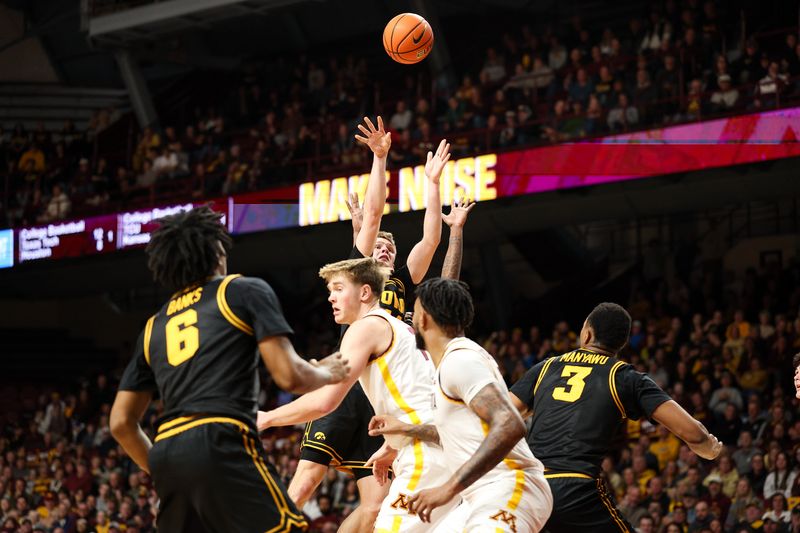 Jan 6, 2026; Minneapolis, Minnesota, USA; Iowa Hawkeyes guard Bennett Stirtz (14) shoots against the Minnesota Golden Gophers during the second half at Williams Arena. Mandatory Credit: Matt Krohn-Imagn Images