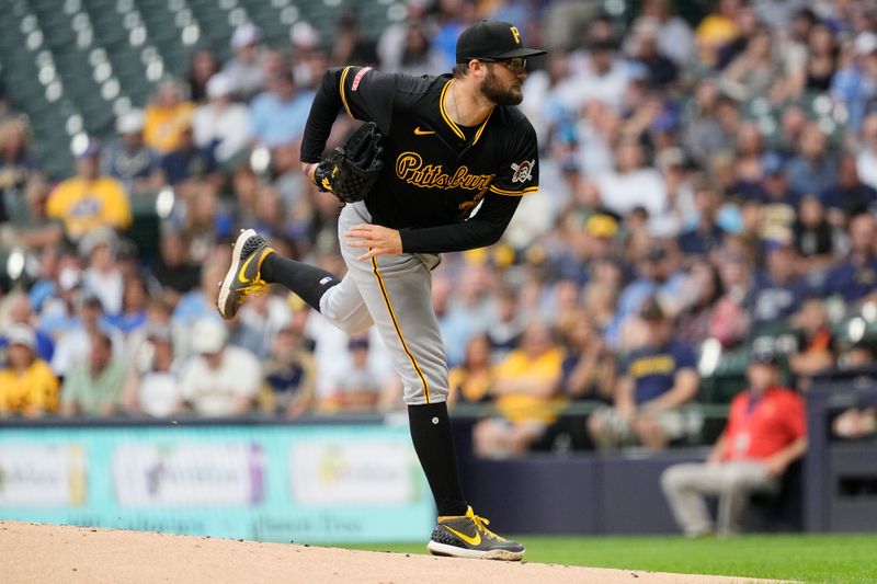 Jul 9, 2024; Milwaukee, Wisconsin, USA;  Pittsburgh Pirates pitcher Josh Fleming (28) throws a pitch during the first inning against the Milwaukee Brewers at American Family Field. Mandatory Credit: Jeff Hanisch-USA TODAY Sports