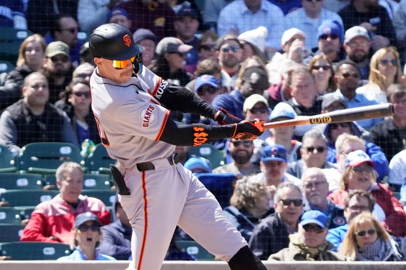 May 7, 2025; Chicago, Illinois, USA; San Francisco Giants second base Christian Koss (50) hits a one run single against the Chicago Cubs during the fourth inning at Wrigley Field. Mandatory Credit: David Banks-Imagn Images