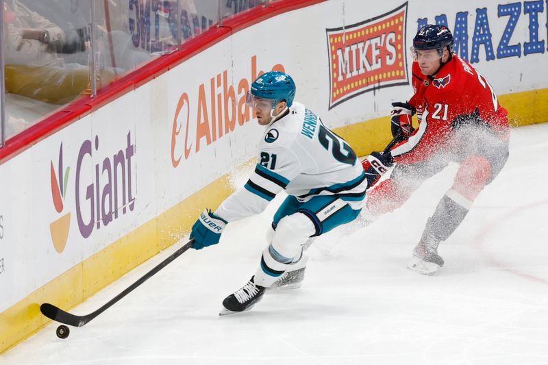 Dec 3, 2024; Washington, District of Columbia, USA; San Jose Sharks center Alexander Wennberg (21) and Washington Capitals center Aliaksei Protas (21) battle for the puck in the first period at Capital One Arena. Mandatory Credit: Geoff Burke-Imagn Images