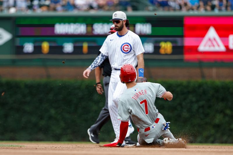 Jul 4, 2024; Chicago, Illinois, USA; Philadelphia Phillies shortstop Trea Turner (7) steals second base against the Chicago Cubs during the first inning at Wrigley Field. Mandatory Credit: Kamil Krzaczynski-USA TODAY Sports