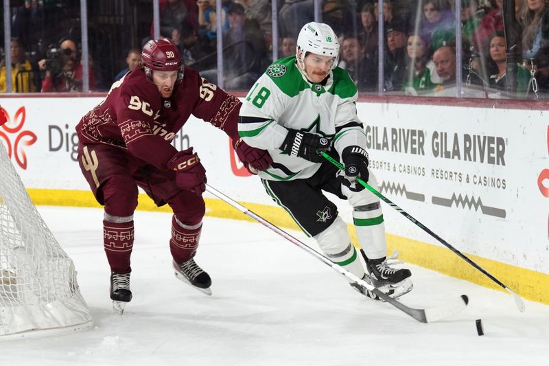 Mar 24, 2024; Tempe, Arizona, USA; Dallas Stars center Sam Steel (18) skates against Arizona Coyotes defenseman J.J. Moser (90) during the first period at Mullett Arena. Mandatory Credit: Joe Camporeale-USA TODAY Sports