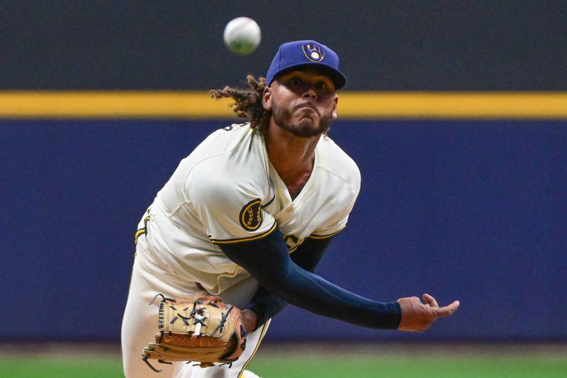 Apr 5, 2024; Milwaukee, Wisconsin, USA; Milwaukee Brewers pitcher Freddy Peralta (51) throws a pitch in the first inning against the Seattle Mariners at American Family Field. Mandatory Credit: Benny Sieu-USA TODAY Sports