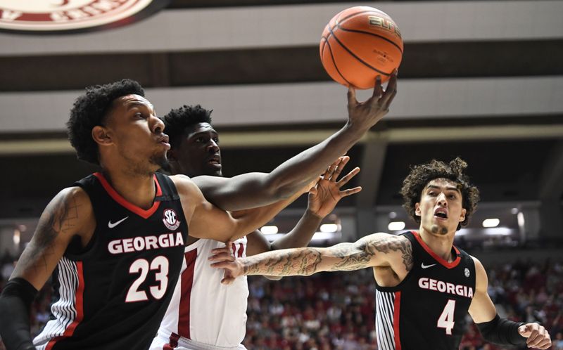 Feb 18, 2023; Tuscaloosa, Alabama, USA;  Georgia center Braelen Bridges (23) and Georgia guard Jusaun Holt (4) work for a rebound against Alabama center Charles Bediako (14) at Coleman Coliseum. Mandatory Credit: Gary Cosby Jr.-USA TODAY Sports