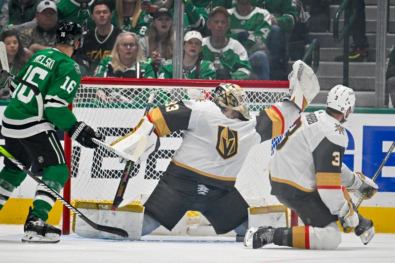 May 1, 2024; Dallas, Texas, USA; Vegas Golden Knights goaltender Adin Hill (33) makes a glove save as Dallas Stars center Joe Pavelski (16) looks for the reboundduring the first period in game five of the first round of the 2024 Stanley Cup Playoffs at the American Airlines Center. Mandatory Credit: Jerome Miron-USA TODAY Sports