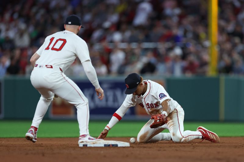 Jun 3, 2025; Boston, Massachusetts, USA; Boston Red Sox second baseman Kristian Campbell (28) attempts to field a ball during the fifth inning against the Los Angeles Angels at Fenway Park. Mandatory Credit: Paul Rutherford-Imagn Images