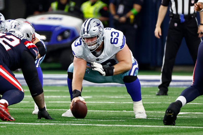 Dallas Cowboys center Tyler Biadasz (63) prepares to snap the ball during the first half of an NFL football game against the New England Patriots in Arlington, Texas, Sunday, Oct. 1, 2023. (AP Photo/Roger Steinman)