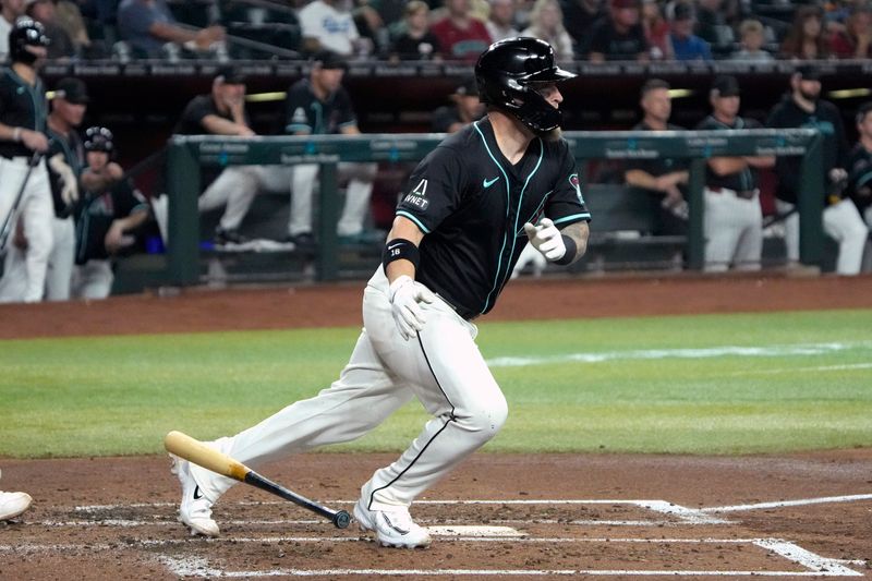 Jun 14, 2024; Phoenix, Arizona, USA; Arizona Diamondbacks catcher Tucker Barnhart (16) hits an RBI single against the Chicago White Sox in the second inning at Chase Field. Mandatory Credit: Rick Scuteri-USA TODAY Sports