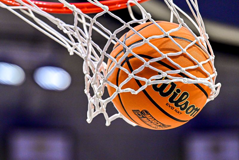 Mar 25, 2024; South Bend, Indiana, USA; A ball goes through the net during warmups before the game between the Ole Miss Rebels and the Notre Dame Fighting Irish in the NCAA Tournament second round game at the Purcell Pavilion. Mandatory Credit: Matt Cashore-USA TODAY Sports
