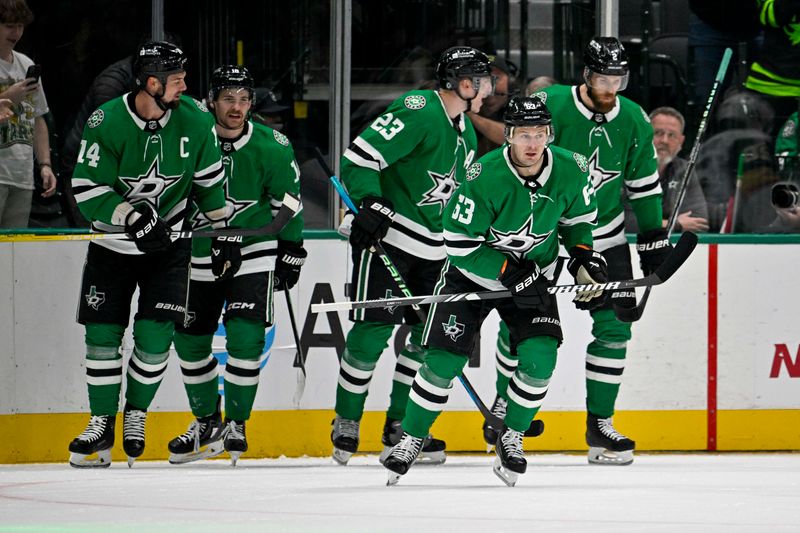 Dec 9, 2023; Dallas, Texas, USA; Dallas Stars left wing Jamie Benn (14) and center Sam Steel (18) and defenseman Esa Lindell (23) and right wing Evgenii Dadonov (63) and defenseman Jani Hakanpaa (2) skate off the ice after Dadonov scores a goal against the Vegas Golden Knights during the first period at the American Airlines Center. Mandatory Credit: Jerome Miron-USA TODAY Sports