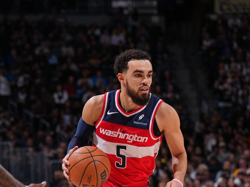 DENVER, CO - FEBRUARY 22: Tyus Jones #5 of the Washington Wizards handles the ball during the game against the Denver Nuggets on February 22, 2024 at the Ball Arena in Denver, Colorado. NOTE TO USER: User expressly acknowledges and agrees that, by downloading and/or using this Photograph, user is consenting to the terms and conditions of the Getty Images License Agreement. Mandatory Copyright Notice: Copyright 2024 NBAE (Photo by Bart Young/NBAE via Getty Images)