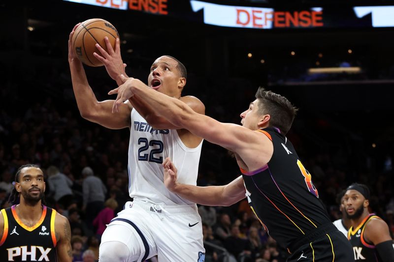 PHOENIX, ARIZONA - DECEMBER 02: Desmond Bane #22 of the Memphis Grizzlies shoots a basket against Grayson Allen #8 of the Phoenix Suns during the fourth quarter at Footprint Center on December 02, 2023 in Phoenix, Arizona. NOTE TO USER: User expressly acknowledges and agrees that, by downloading and or using this photograph, User is consenting to the terms and conditions of the Getty Images License Agreement. (Photo by Zac BonDurant/Getty Images)