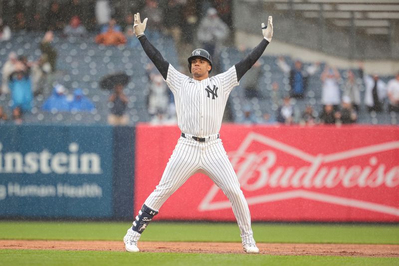 May 5, 2024; Bronx, New York, USA; New York Yankees right fielder Juan Soto (22) reacts after his three RBI double during the seventh inning against the Detroit Tigers at Yankee Stadium. Mandatory Credit: Vincent Carchietta-USA TODAY Sports