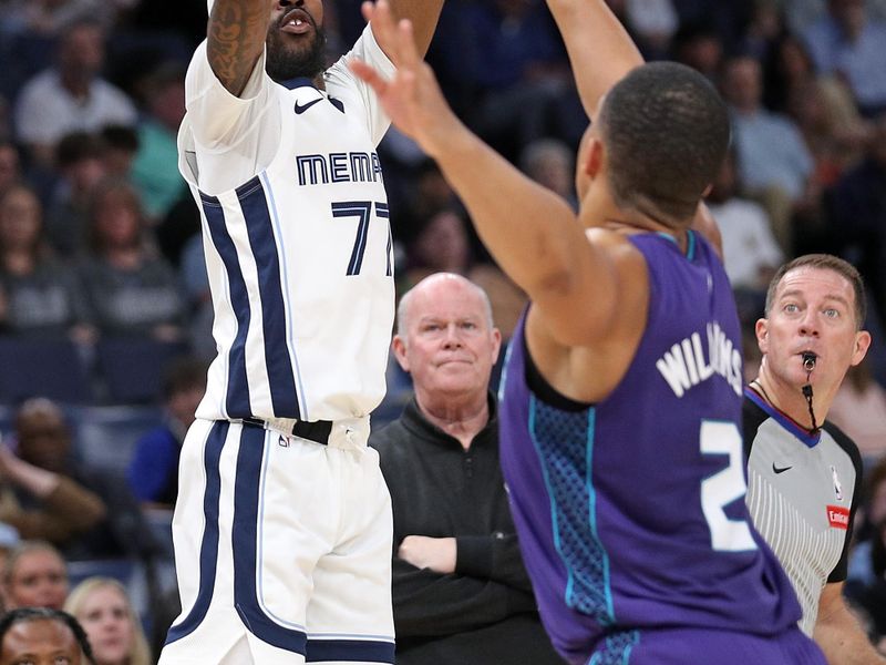 MEMPHIS, TENNESSEE - MARCH 13: DeJon Jarreau #77 of the Memphis Grizzlies shoots against Grant Williams #2 of the Charlotte Hornets during the first half at FedExForum on March 13, 2024 in Memphis, Tennessee. NOTE TO USER: User expressly acknowledges and agrees that, by downloading and or using this photograph, User is consenting to the terms and conditions of the Getty Images License Agreement. (Photo by Justin Ford/Getty Images)