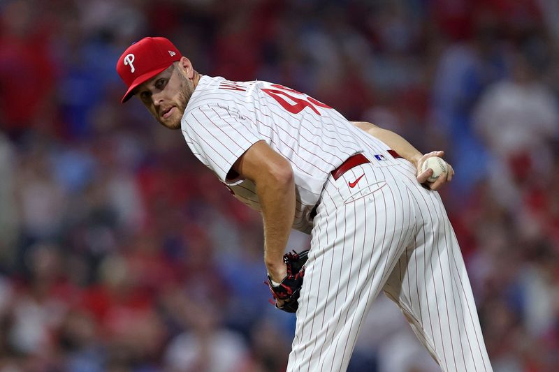 Oct 3, 2023; Philadelphia, Pennsylvania, USA; Philadelphia Phillies starting pitcher Zack Wheeler (45) looks toward first base in the third inning for game one of the Wildcard series for the 2023 MLB playoffs against the Miami Marlins at Citizens Bank Park. Mandatory Credit: Bill Streicher-USA TODAY Sports