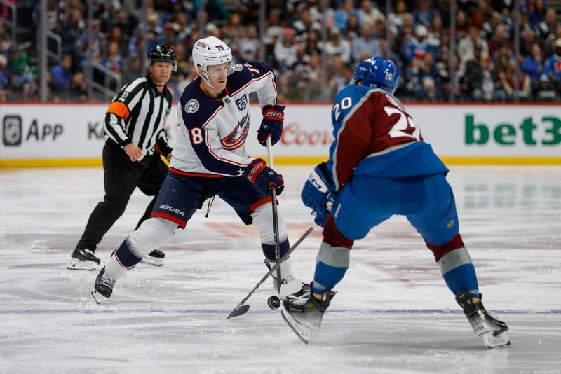 Jan 10, 2026; Denver, Colorado, USA; Colorado Avalanche center Ross Colton (20) knocks the puck away from Columbus Blue Jackets defenseman Damon Severson (78) in the third period at Ball Arena. Mandatory Credit: Isaiah J. Downing-Imagn Images