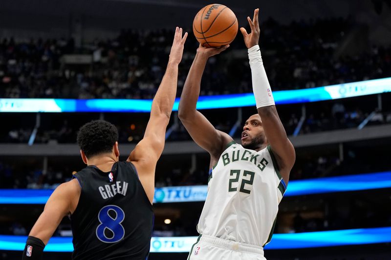 DALLAS, TEXAS - FEBRUARY 03: Khris Middleton #22 of the Milwaukee Bucks shoots as Josh Green #8 of the Dallas Mavericks defends during the second half at American Airlines Center on February 03, 2024 in Dallas, Texas. NOTE TO USER: User expressly acknowledges and agrees that, by downloading and or using this photograph, User is consenting to the terms and conditions of the Getty Images License Agreement. (Photo by Sam Hodde/Getty Images)