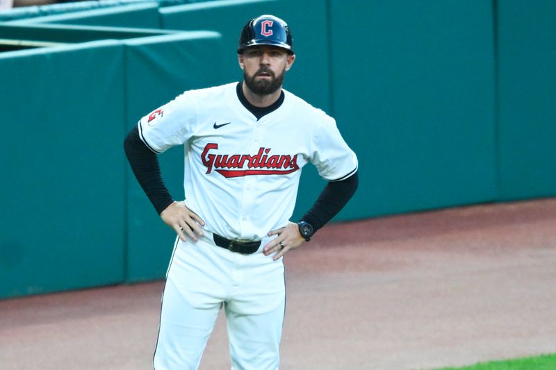 Aug 14, 2024; Cleveland, Ohio, USA; Cleveland Guardians base running and outfield coach J.T. Maguire (84) coaches third base in the third inning against the Chicago Cubs at Progressive Field. Mandatory Credit: David Richard-USA TODAY Sports