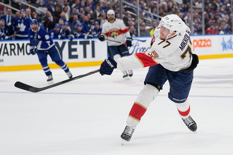 May 14, 2025; Toronto, Ontario, CAN; Florida Panthers defenseman Niko Mikkola (77) scores on this shot against the Toronto Maple Leafs during the second period of game five of the second round of the 2025 Stanley Cup Playoffs at Scotiabank Arena. Mandatory Credit: John E. Sokolowski-Imagn Images