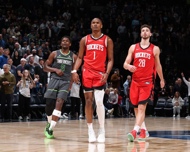 MINNEAPOLIS, MN - FEBRUARY 6: Amen Thompson #1 and Alperen Sengun #28 of the Houston Rockets look on during the game with Anthony Edwards #5 of the Minnesota Timberwolves on February 6, 2025 at Target Center in Minneapolis, Minnesota. NOTE TO USER: User expressly acknowledges and agrees that, by downloading and or using this Photograph, user is consenting to the terms and conditions of the Getty Images License Agreement. Mandatory Copyright Notice: Copyright 2025 NBAE(Photo by David Sherman/NBAE via Getty Images)