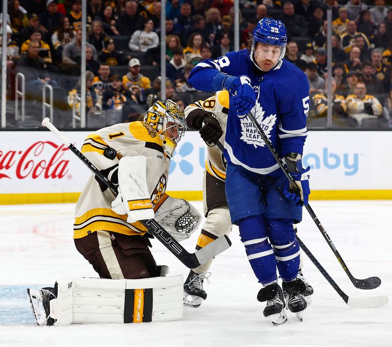 Mar 7, 2024; Boston, Massachusetts, USA; Boston Bruins goaltender Jeremy Swayman (1) makes an arm save as Toronto Maple Leafs left wing Tyler Bertuzzi (59) screens him in front during the second period at TD Garden. Mandatory Credit: Winslow Townson-USA TODAY Sports