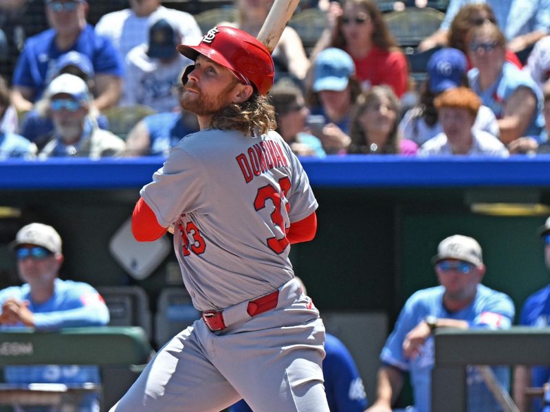 May 18, 2025; Kansas City, Missouri, USA;  St. Louis Cardinals second baseman Brendan Donovan (33) singles in the first inning against the Kansas City Royals at Kauffman Stadium. Mandatory Credit: Peter Aiken-Imagn Images