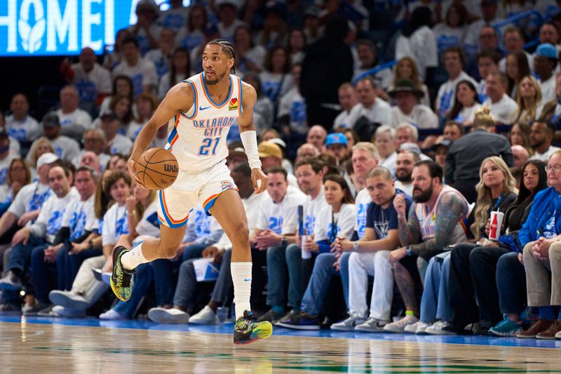 OKLAHOMA CITY, OKLAHOMA - APRIL 21: Aaron Wiggins #21 of the Oklahoma City Thunder brings the ball up court against the New Orleans Pelicans in game one of the Western Conference First Round Playoffs at the Paycom Center on April 21, 2024 in Oklahoma City, Oklahoma. NOTE TO USER: User expressly acknowledges and agrees that, by downloading and or using this photograph, User is consenting to the terms and conditions of the Getty Images License Agreement.  (Photo by Cooper Neill/Getty Images)