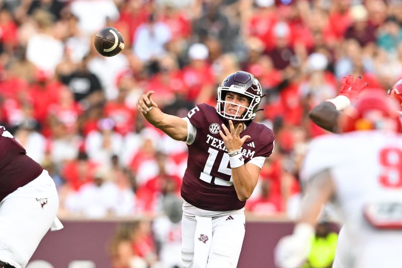 Sep 2, 2023; College Station, Texas, USA; Texas A&M Aggies quarterback Conner Weigman (15) throws a pass during the first quarter against the New Mexico Lobos at Kyle Field. Mandatory Credit: Maria Lysaker-USA TODAY Sports