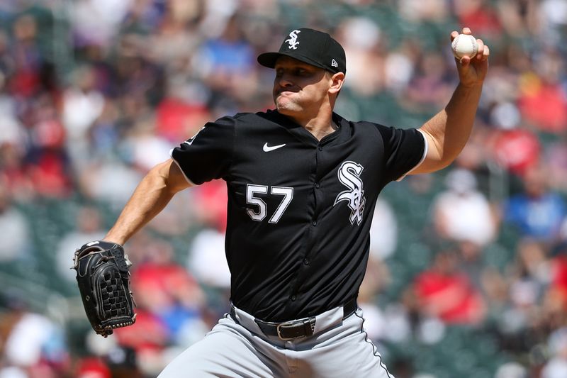 Apr 25, 2024; Minneapolis, Minnesota, USA; Chicago White Sox pitcher Tanner Banks (57) delivers a pitch against the Minnesota Twins during the sixth inning at Target Field. Mandatory Credit: Matt Krohn-USA TODAY Sports