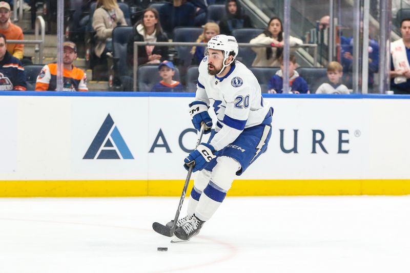 Feb 24, 2024; Elmont, New York, USA;  Tampa Bay Lightning left wing Nicholas Paul (20) attempts a shot on goal in the first period against the New York Islanders at UBS Arena. Mandatory Credit: Wendell Cruz-USA TODAY Sports