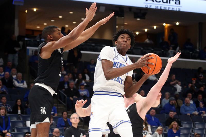 Jan 31, 2024; Memphis, Tennessee, USA; Memphis Tigers forward Nae'Qwan Tomlin (7) drives to the basket as Memphis Tigers center Jordan Brown (3) defends during the first half at FedExForum. Mandatory Credit: Petre Thomas-USA TODAY Sports